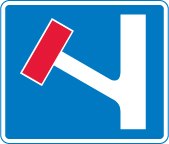 No through road for vehicular traffic in direction indicated from junction ahead symbol