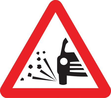 Loose chippings on road ahead symbol